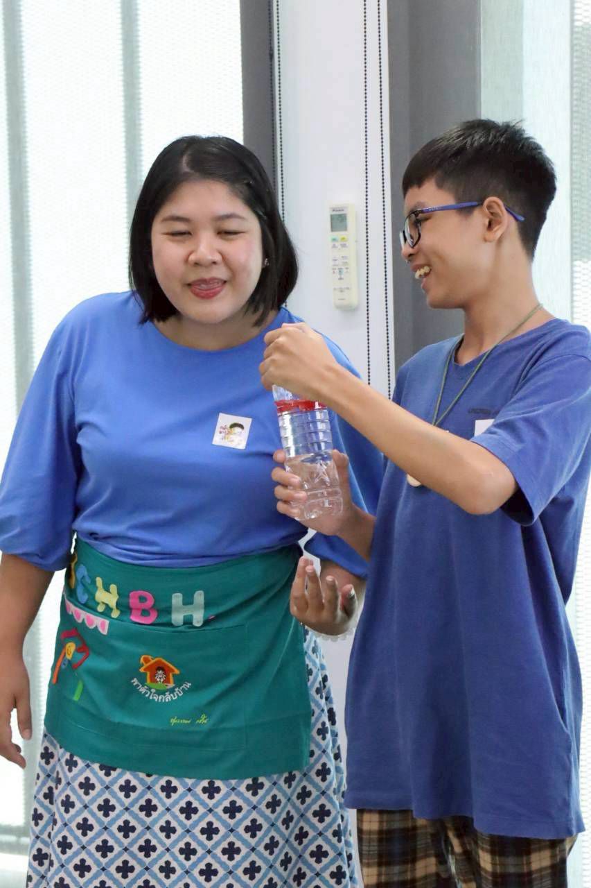 A BCHBH facilitator working gently with a young helper