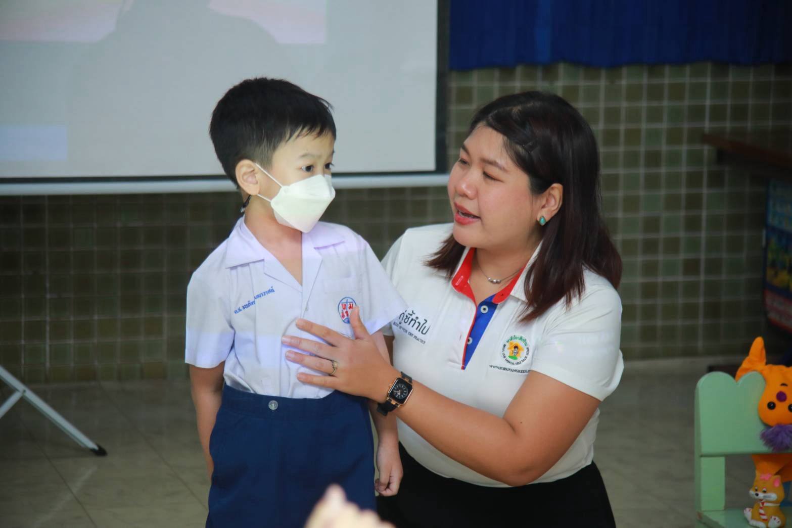A caring teacher connecting with a young student