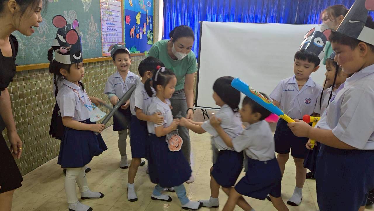 Children acting out an emotional awareness activity together